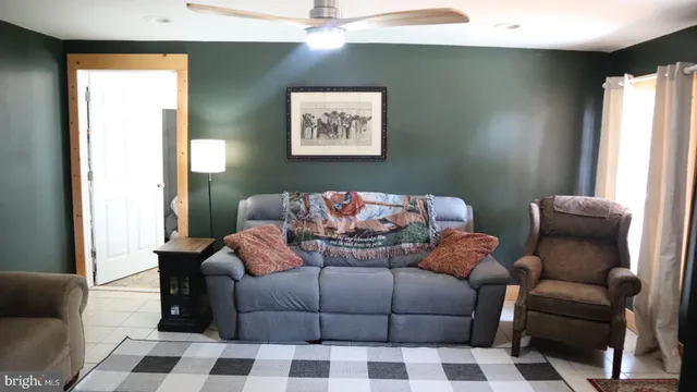 a living room with furniture and a window