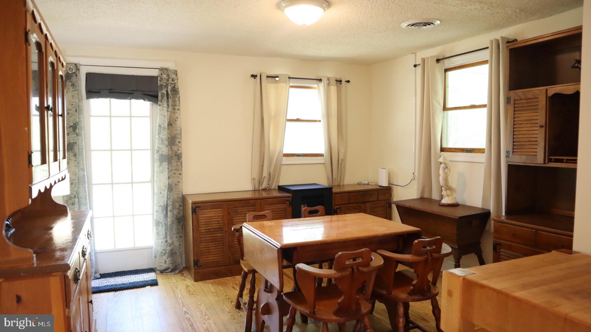 2010 McGinnes Road Chestertown, MD 21620 - Photo 10 of 19 a view of a dining room with furniture and window