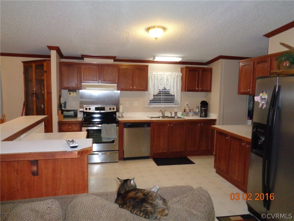 8612 Old Pine Road Ford, VA 23850 - Photo 19 of 27 a kitchen with granite countertop a sink stainless steel appliances and cabinets