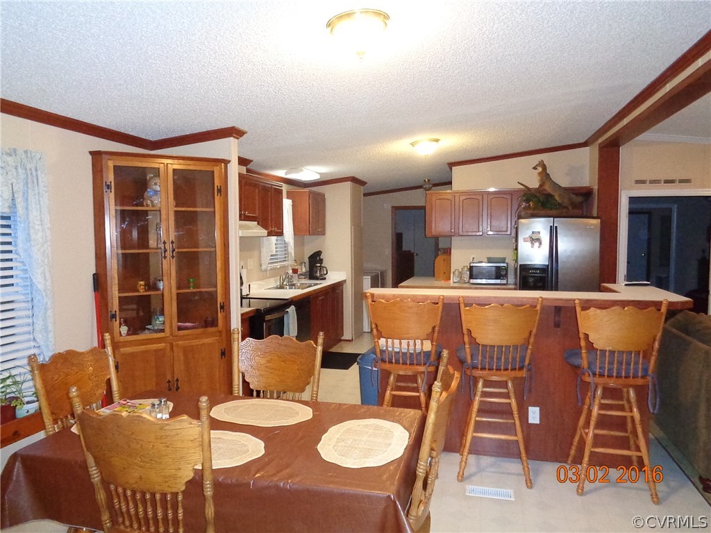 8612 Old Pine Road Ford, VA 23850 - Photo 21 of 27 a dining room with furniture and a floor to ceiling window