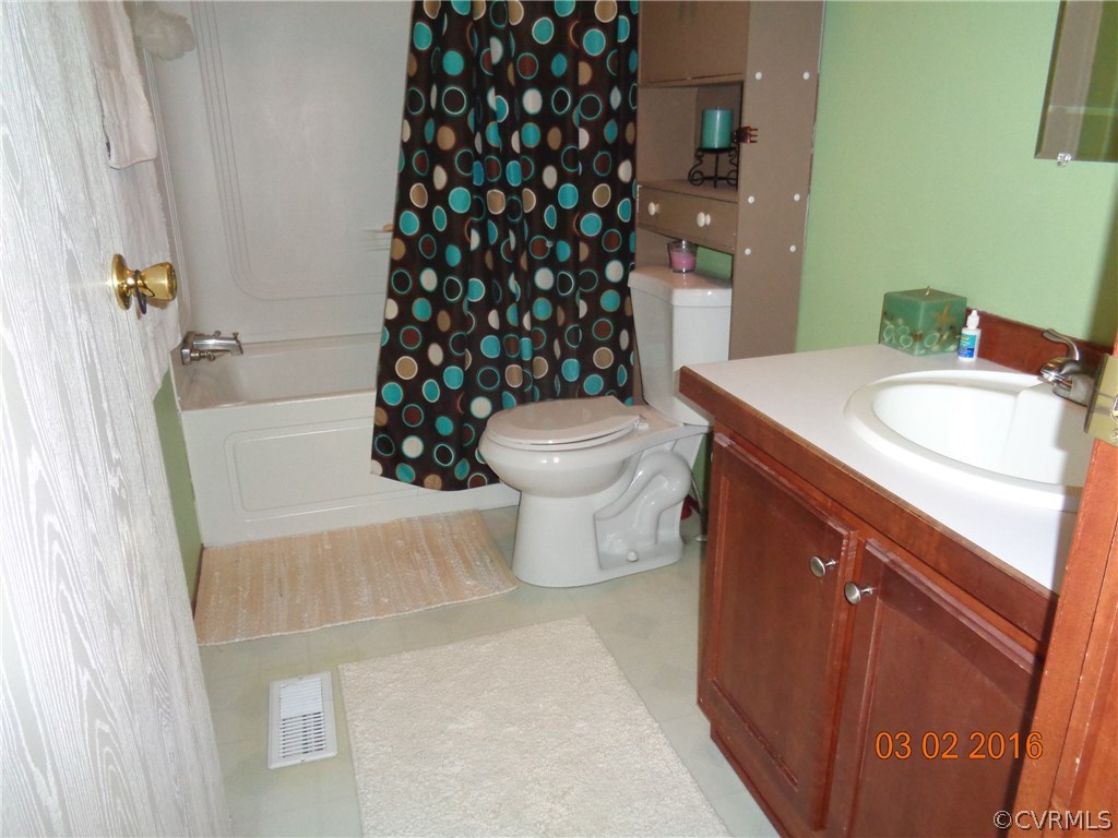 8612 Old Pine Road Ford, VA 23850 - Photo 26 of 27 a bathroom with a sink toilet and shower