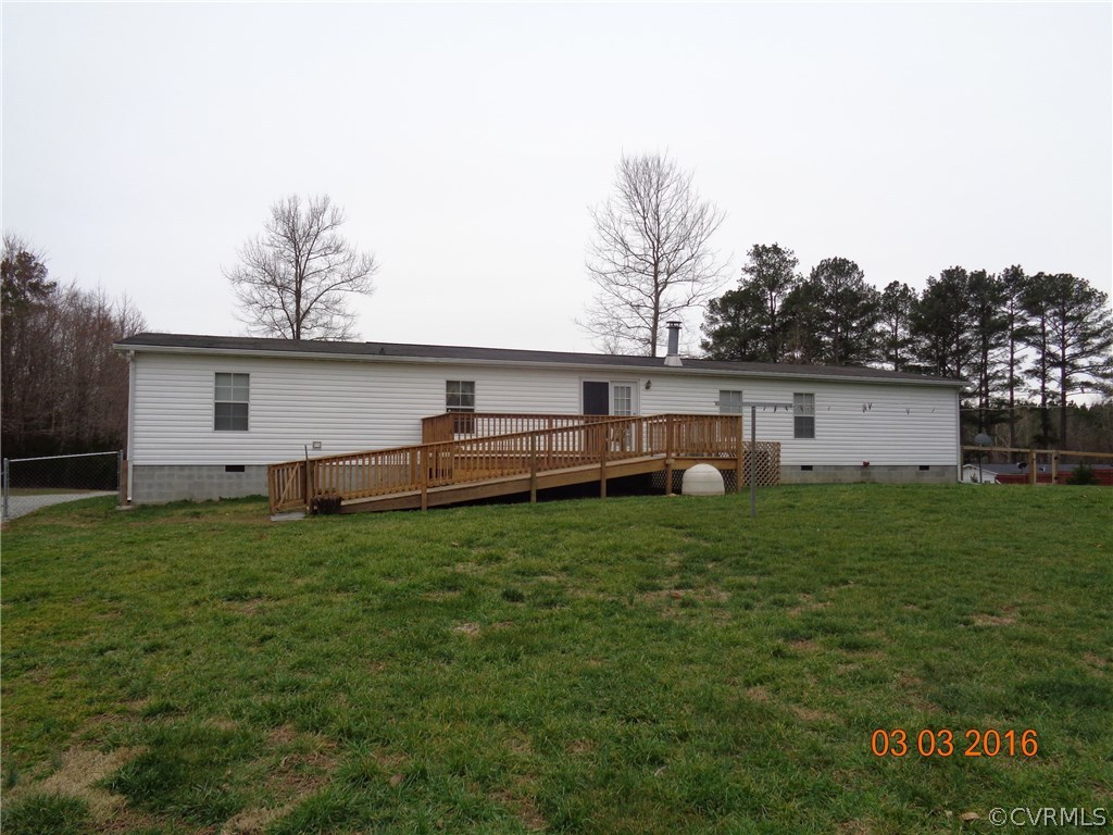 8612 Old Pine Road Ford, VA 23850 - Photo 5 of 27 a view of a backyard with plants and a tree