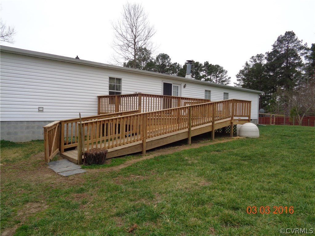 8612 Old Pine Road Ford, VA 23850 - Photo 6 of 27 a view of a house with a yard and deck