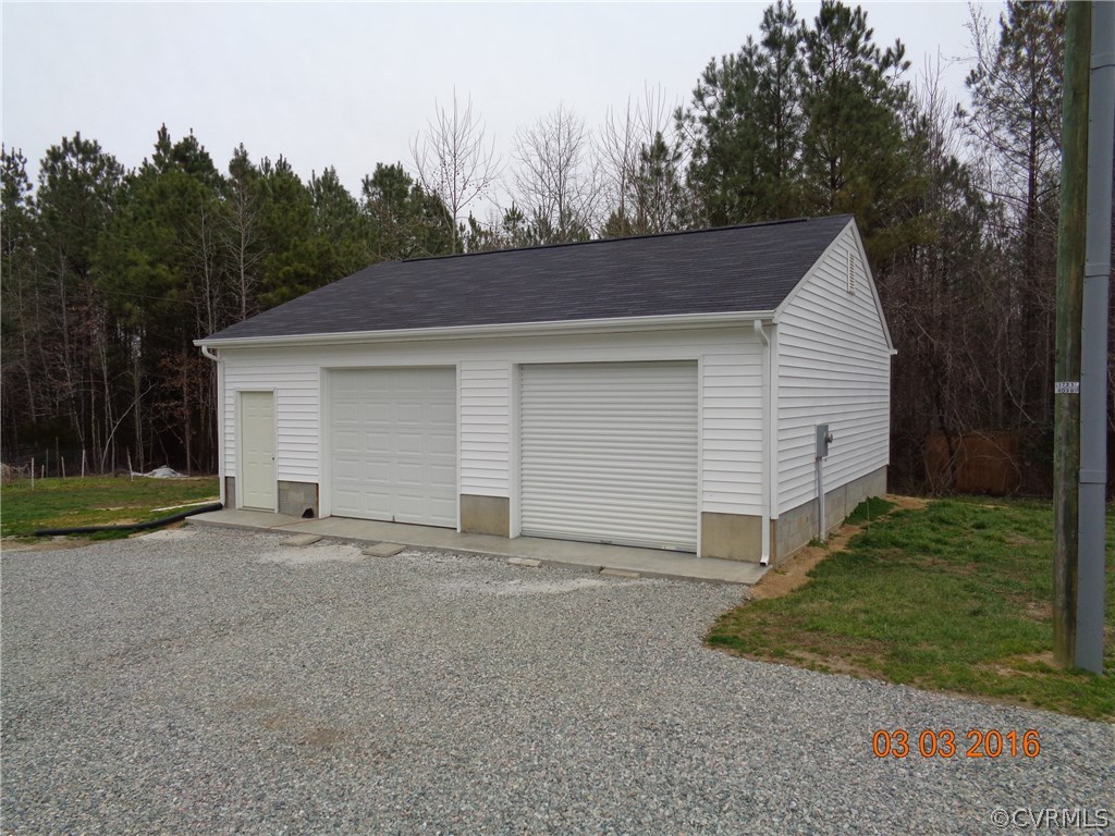 8612 Old Pine Road Ford, VA 23850 - Photo 7 of 27 a view of a house with a yard and garage
