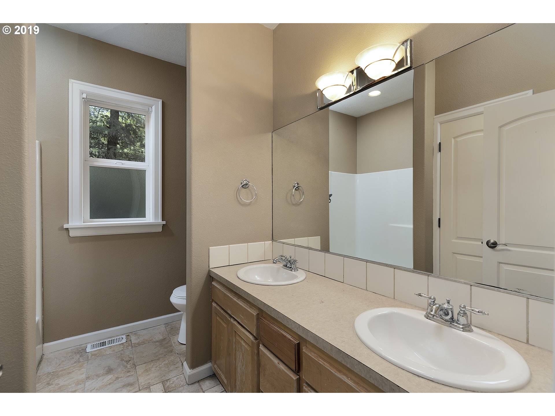 1925 Hillcrest Drive West Linn, OR 97068 - Photo 24 of 32 a bathroom with a sink and a mirror