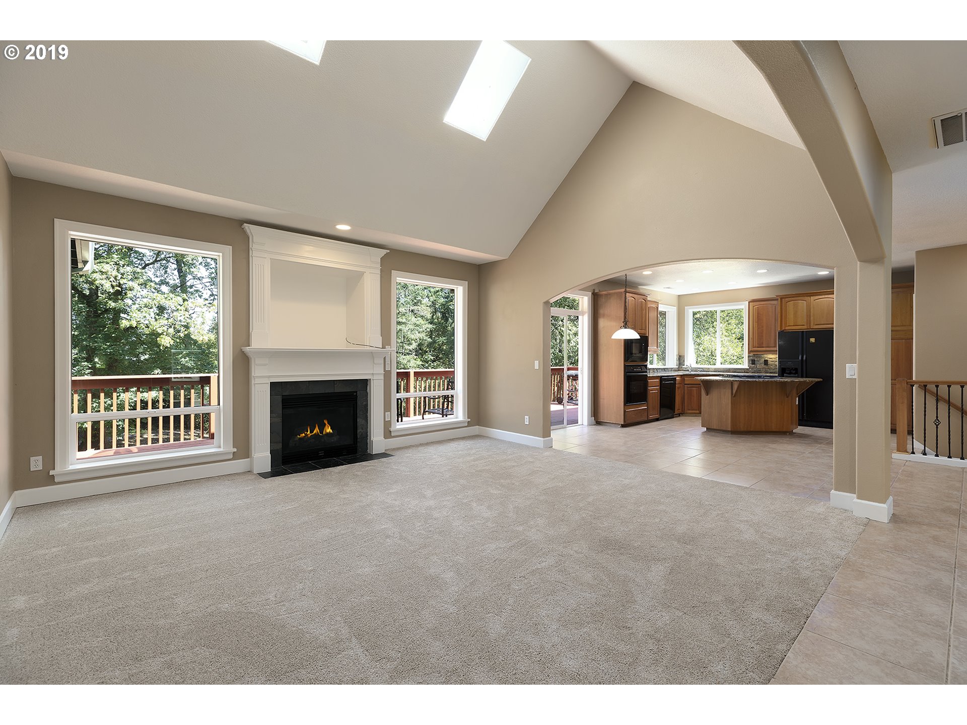 1925 Hillcrest Drive West Linn, OR 97068 - Photo 5 of 32 a view of an empty room with a fireplace and a window