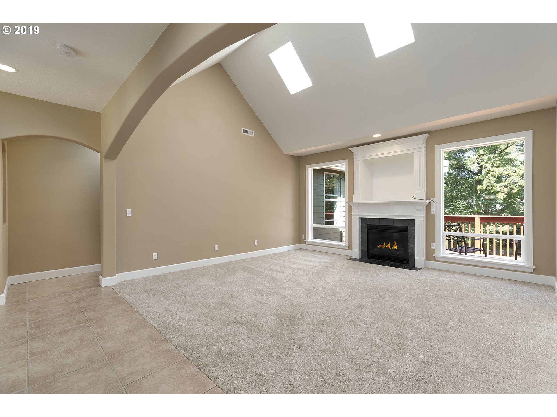 1925 Hillcrest Drive West Linn, OR 97068 - Photo 10 of 32 a view of an empty room with a fireplace and a window