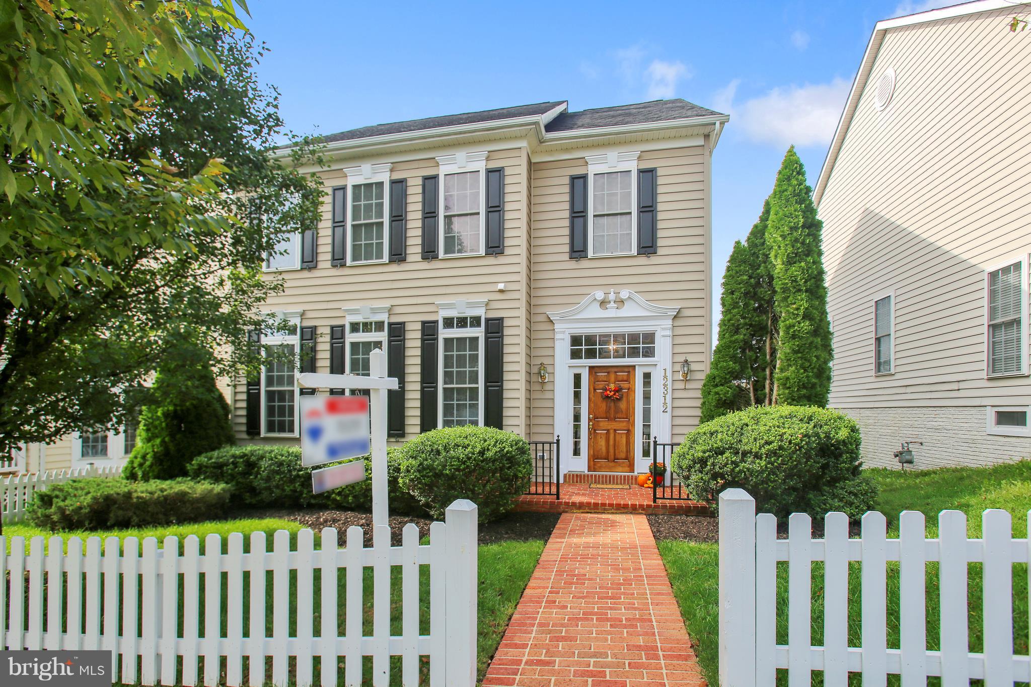 12312 Cypress Spring Road Clarksburg, MD 20871 - Photo 1 of 30 a front view of a house with a yard