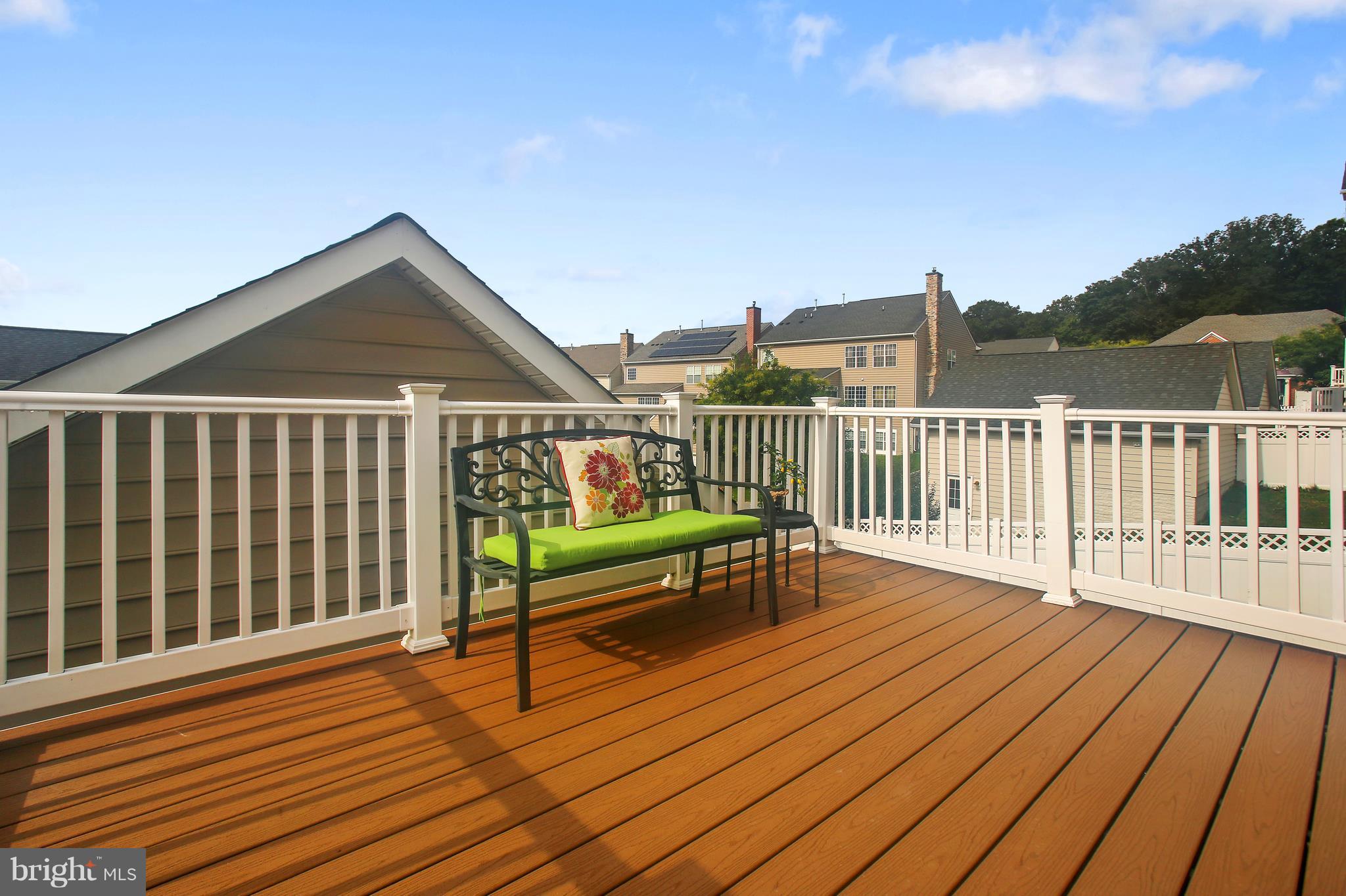 12312 Cypress Spring Road Clarksburg, MD 20871 - Photo 12 of 30 a view of a roof deck with wooden floor and city view