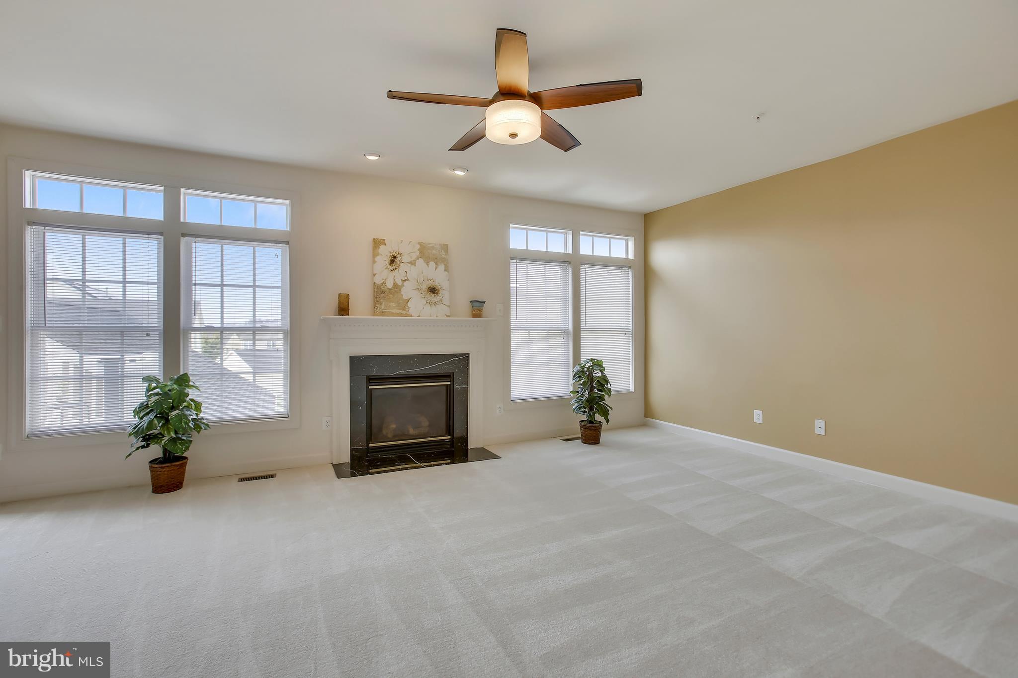 12312 Cypress Spring Road Clarksburg, MD 20871 - Photo 14 of 30 a view of an empty room with a fireplace and a window