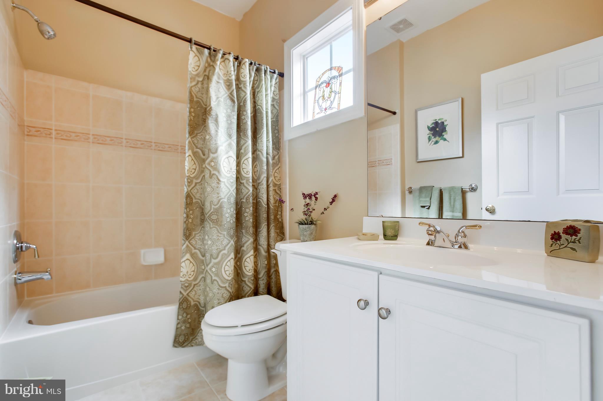 12312 Cypress Spring Road Clarksburg, MD 20871 - Photo 23 of 30 a bathroom with a sink toilet and shower