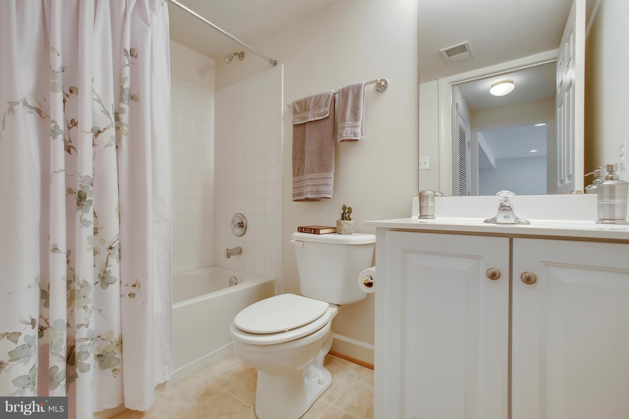 12312 Cypress Spring Road Clarksburg, MD 20871 - Photo 25 of 30 a bathroom with a sink a toilet and shower