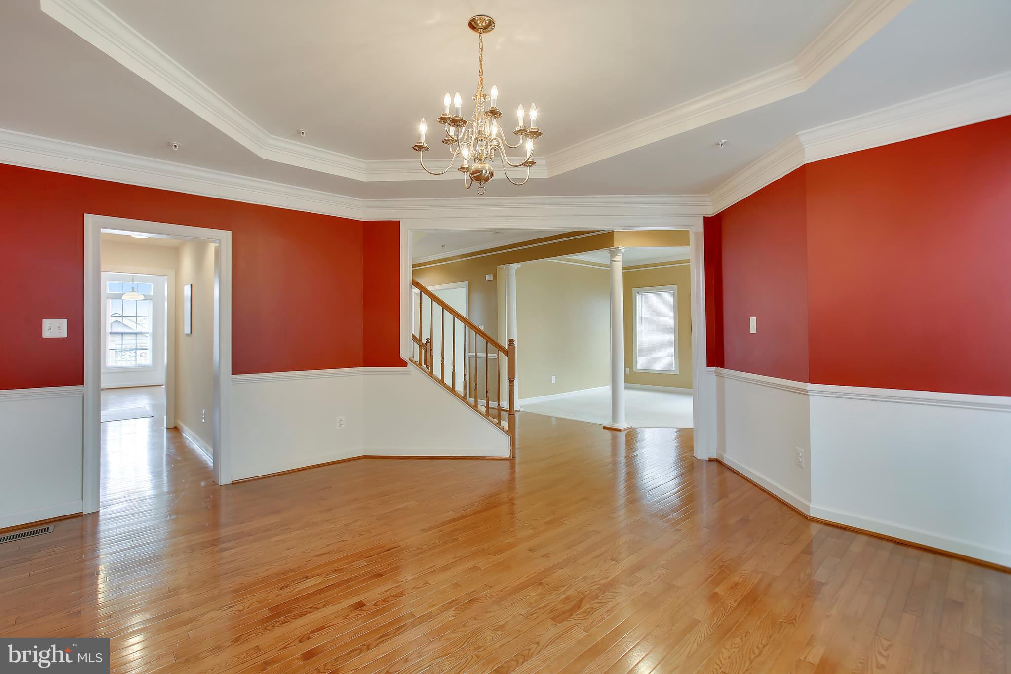 12312 Cypress Spring Road Clarksburg, MD 20871 - Photo 6 of 30 a view of an empty room with window and wooden floor