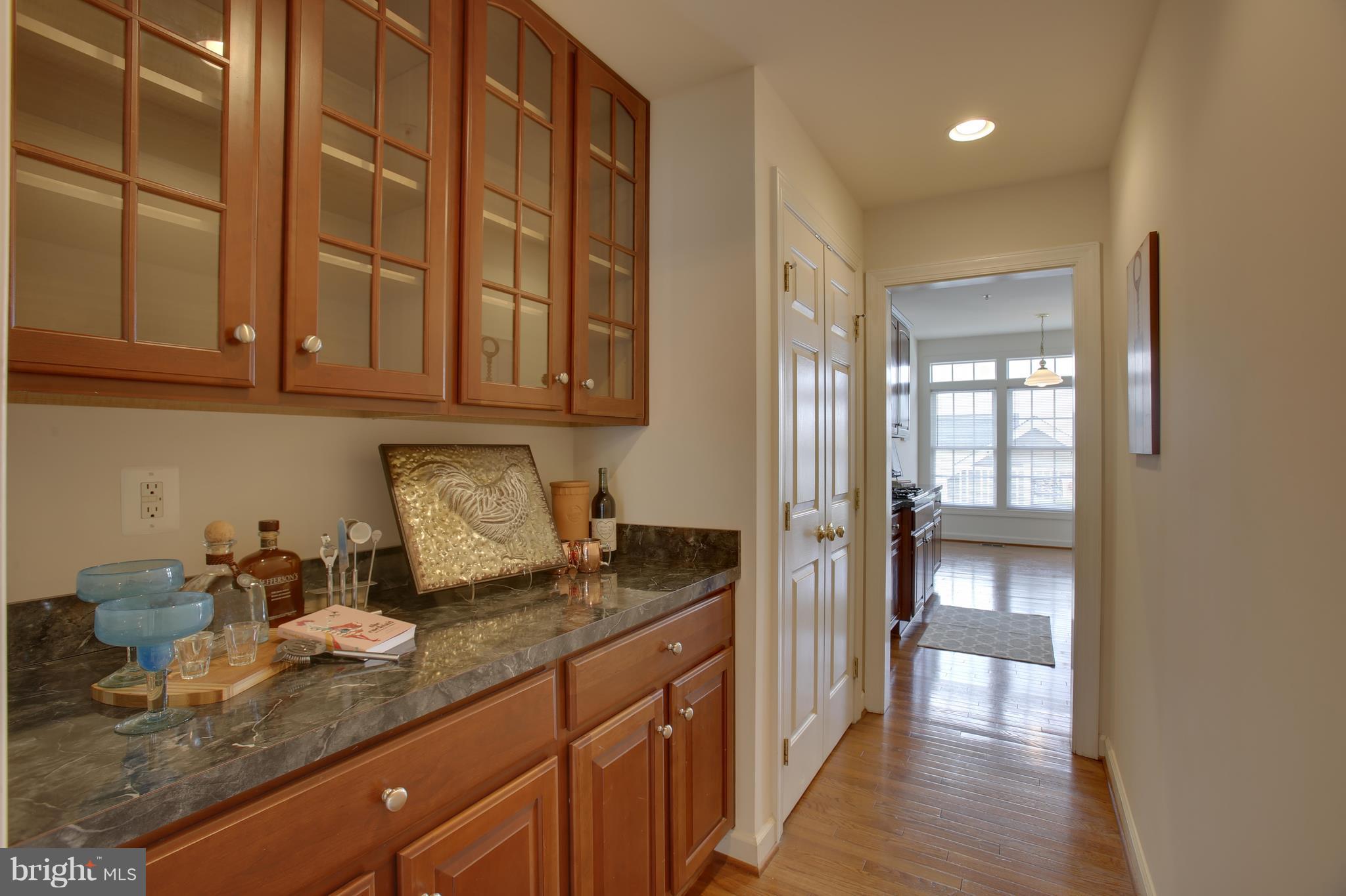 12312 Cypress Spring Road Clarksburg, MD 20871 - Photo 7 of 30 a kitchen with granite countertop stainless steel appliances a sink and cabinets
