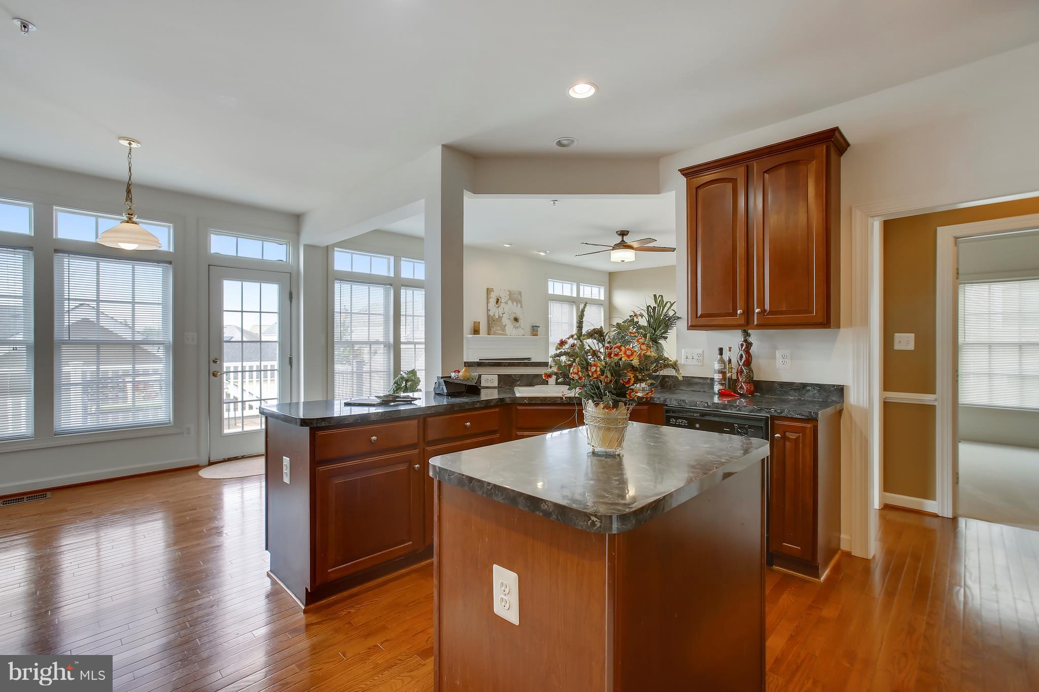 12312 Cypress Spring Road Clarksburg, MD 20871 - Photo 8 of 30 a kitchen with counter top space and wooden floor