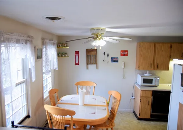 a dining room with furniture and window