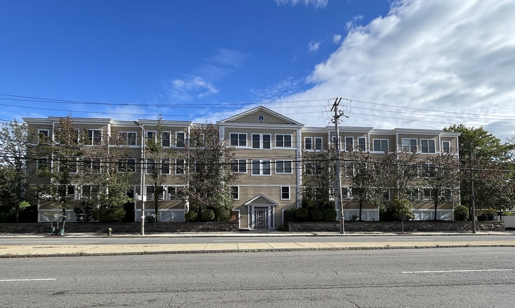 5170 Washington Street, Unit 3 Boston, MA 02132 - Photo 1 of 42 a front view of a house