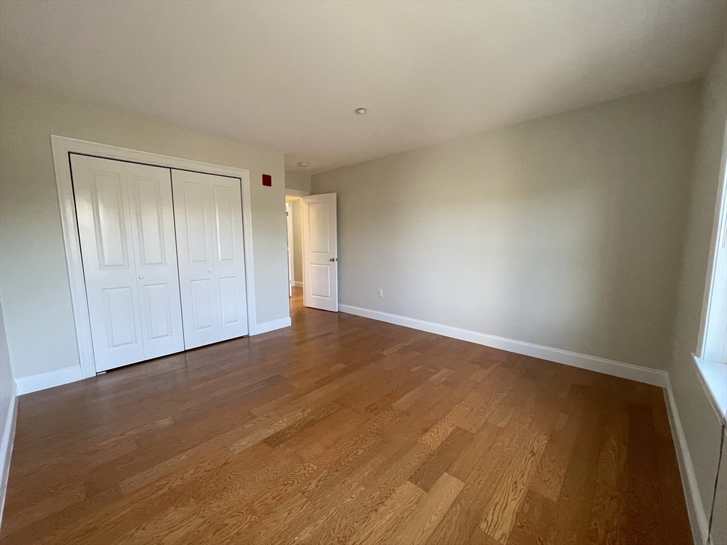5170 Washington Street, Unit 3 Boston, MA 02132 - Photo 22 of 42 a view of an empty room