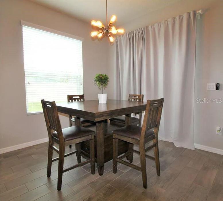 1049 Multiflora Loop Lutz, FL 33558 - Photo 17 of 49 a view of a dining room with furniture window and outside view