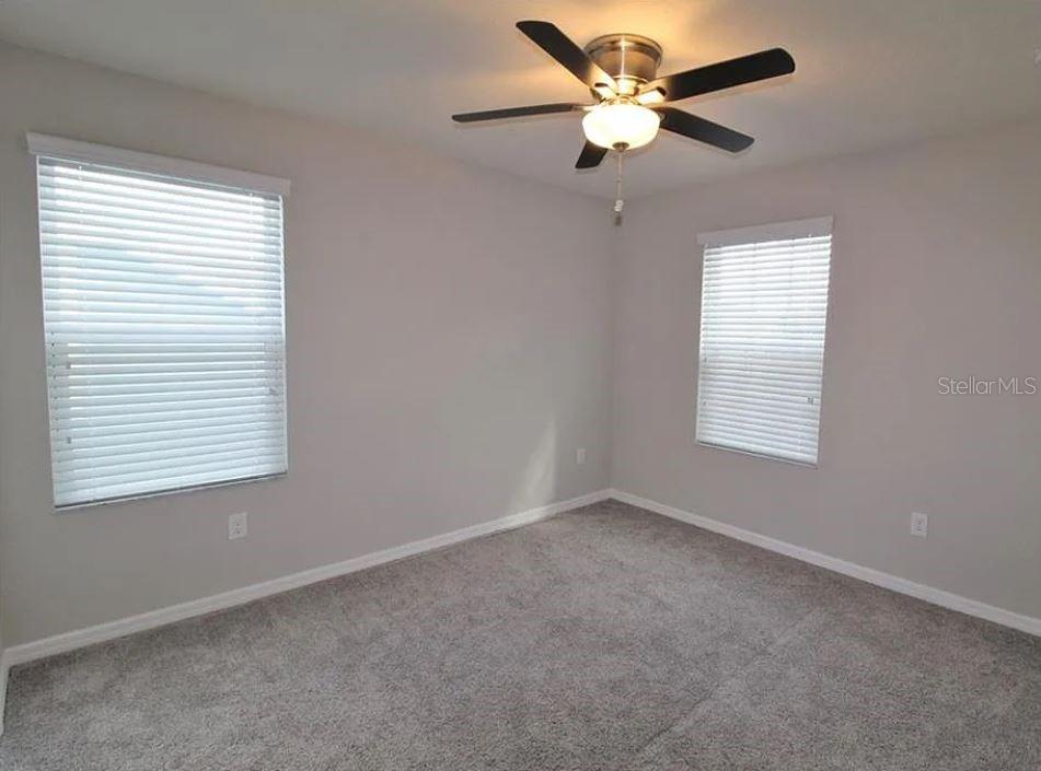 1049 Multiflora Loop Lutz, FL 33558 - Photo 21 of 49 a view of an empty room with a window