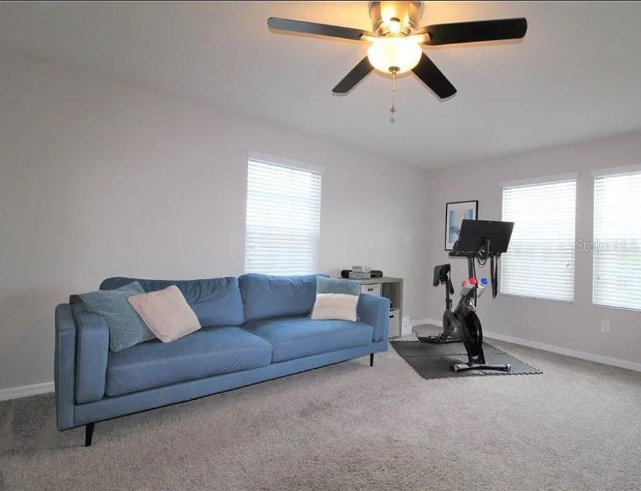 1049 Multiflora Loop Lutz, FL 33558 - Photo 26 of 49 a living room with furniture and a window