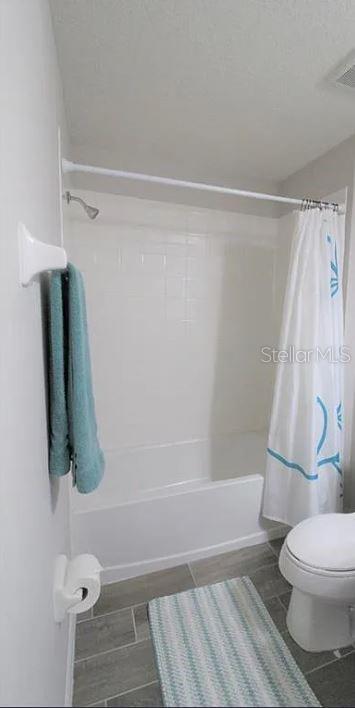 1049 Multiflora Loop Lutz, FL 33558 - Photo 27 of 49 a bathroom with a shower and toilet