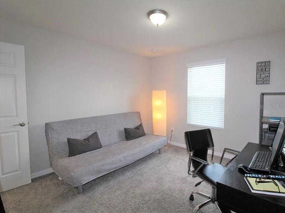 1049 Multiflora Loop Lutz, FL 33558 - Photo 30 of 49 a living room with furniture and a window