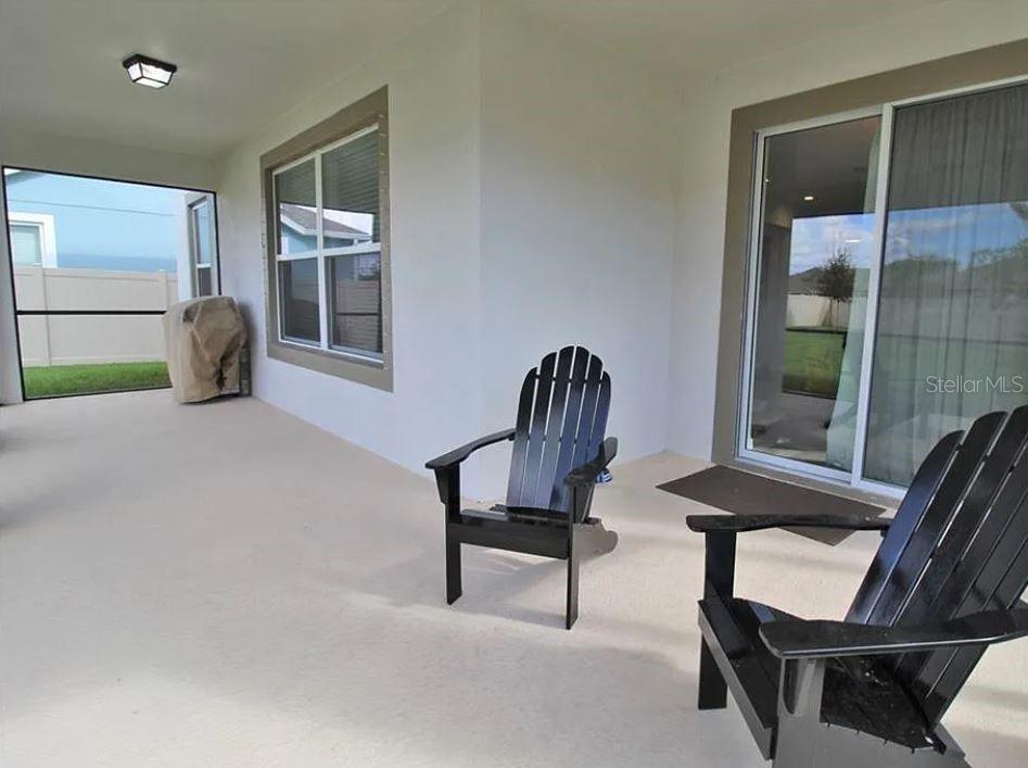 1049 Multiflora Loop Lutz, FL 33558 - Photo 41 of 49 a view of a livingroom with furniture and a window