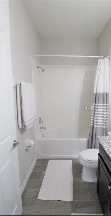 1049 Multiflora Loop Lutz, FL 33558 - Photo 7 of 49 a bathroom with a toilet and a shower