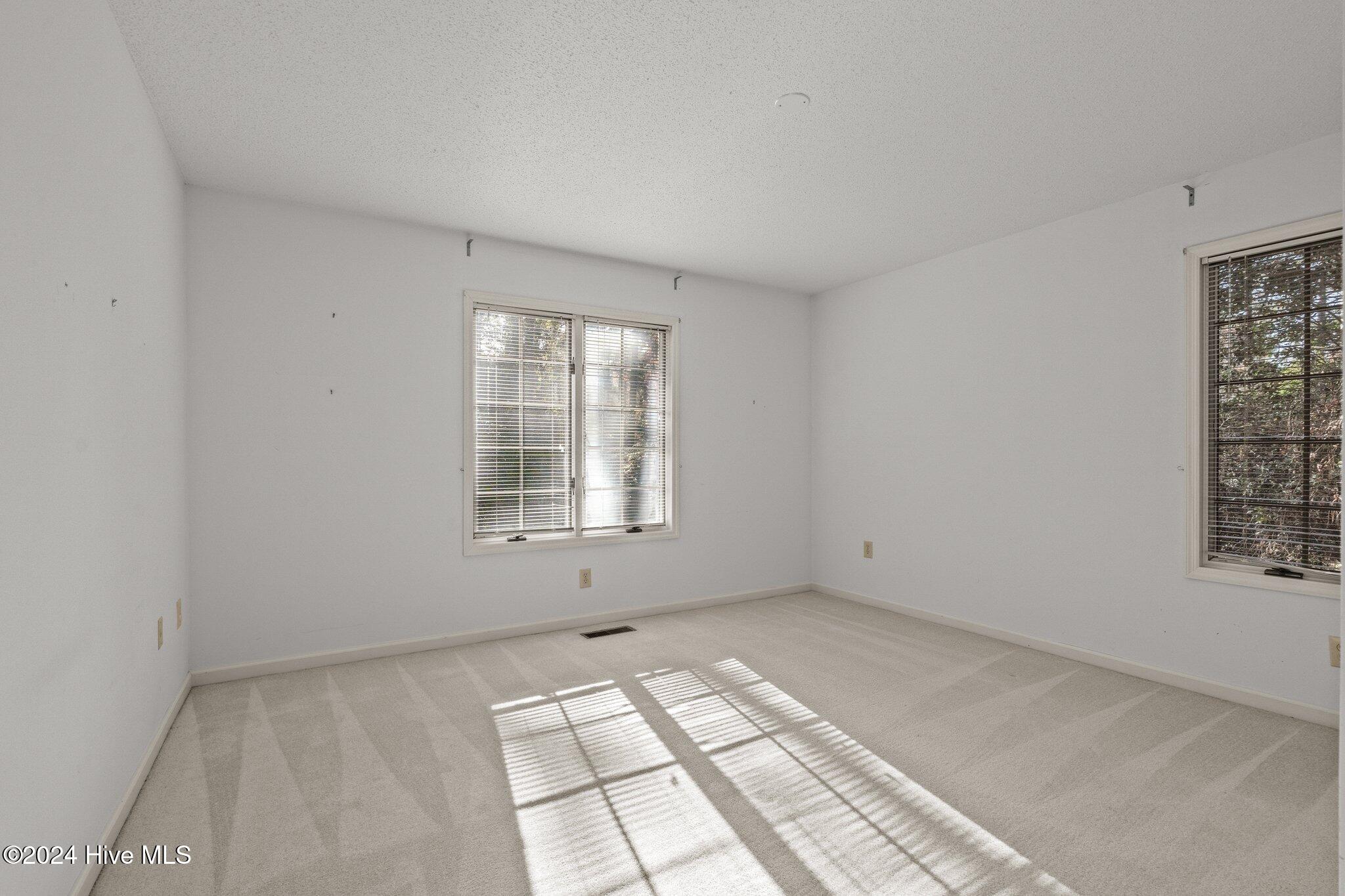 560 South Bethesda Road Southern Pines, NC 28387 - Photo 35 of 53 Second bedroom view from hallway.