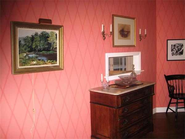 185 Sumner Avenue, Unit 185 Springfield, MA 01108 - Photo 14 of 23 a room with furniture and paintings on wall