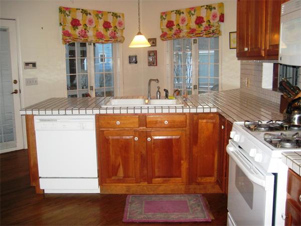 185 Sumner Avenue, Unit 185 Springfield, MA 01108 - Photo 15 of 23 a kitchen with stainless steel appliances granite countertop a stove and cabinets
