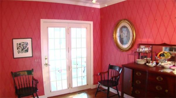 185 Sumner Avenue, Unit 185 Springfield, MA 01108 - Photo 5 of 23 a front view of a house with a table and chairs
