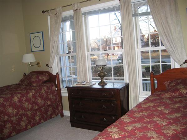185 Sumner Avenue, Unit 185 Springfield, MA 01108 - Photo 7 of 23 a bed room with a bed and a window