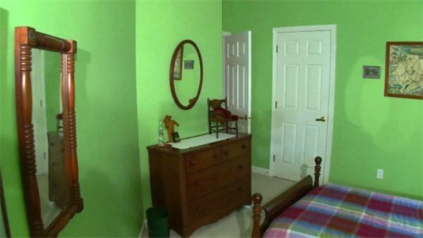 185 Sumner Avenue, Unit 185 Springfield, MA 01108 - Photo 8 of 23 a room with painting on the wall and a window