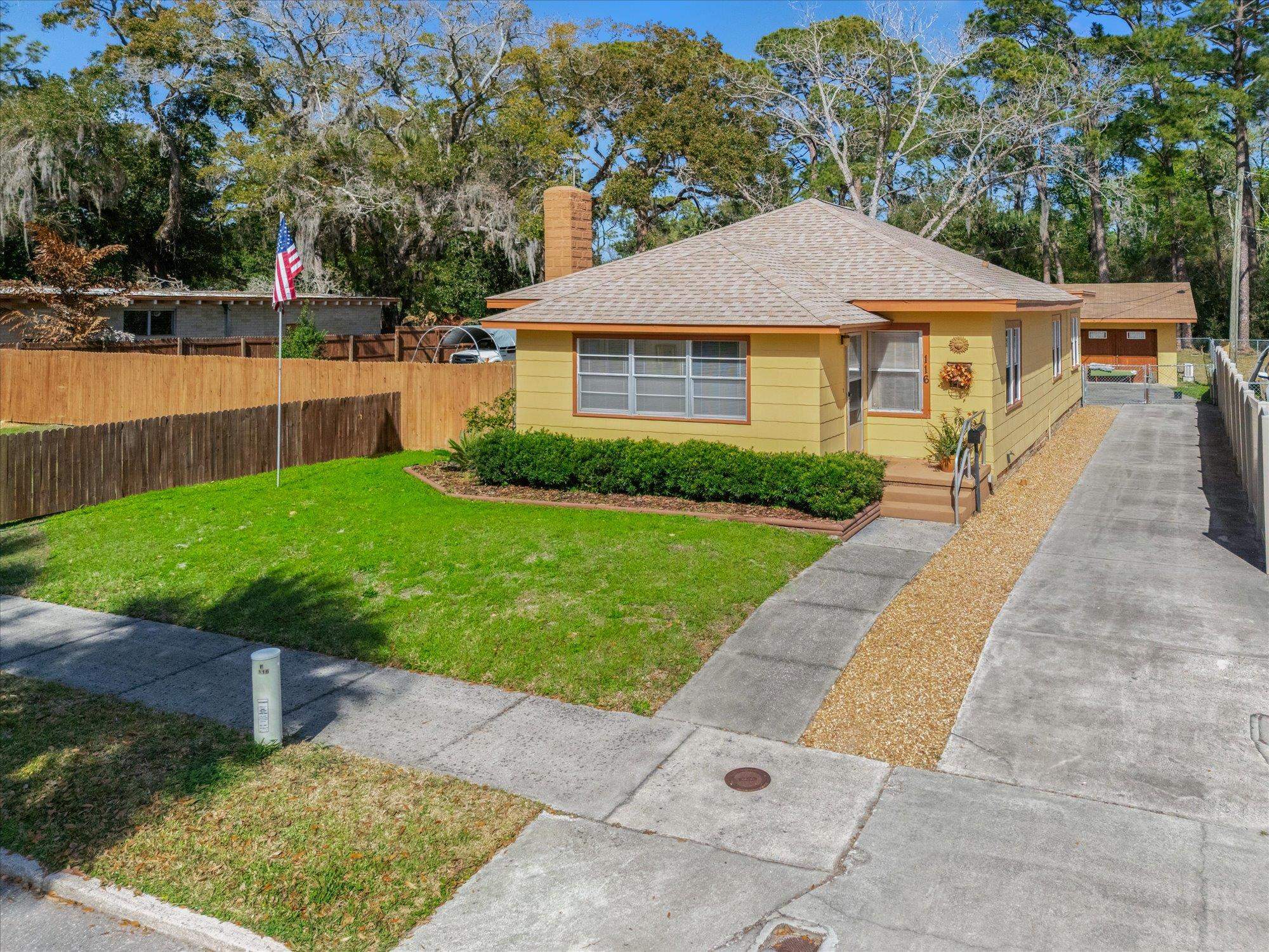 116 Colon Avenue St. Augustine, FL 32084 - Photo 1 of 42 Bungalow-style home with a chimney and a shingled roof