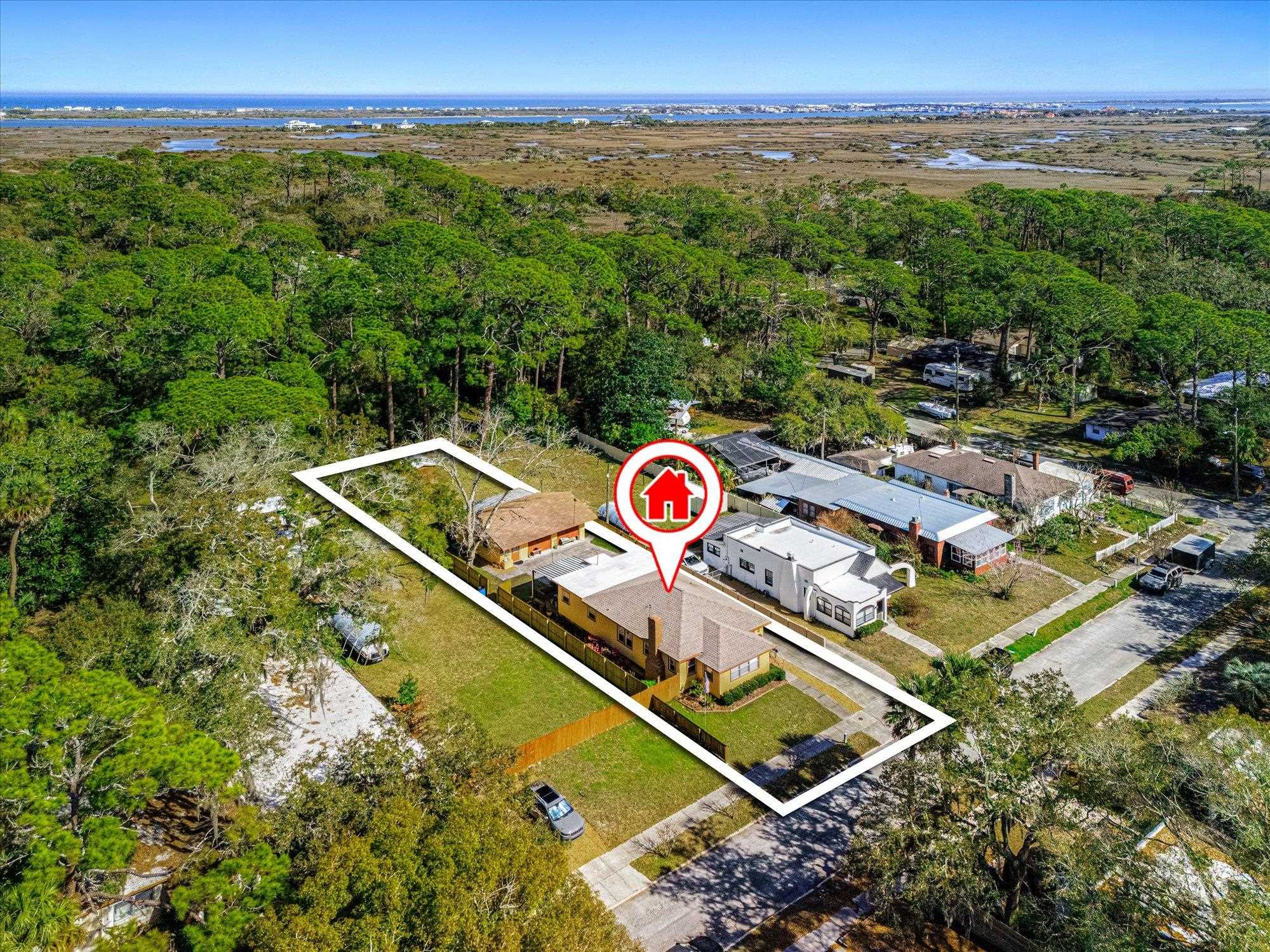 116 Colon Avenue St. Augustine, FL 32084 - Photo 2 of 42 Aerial perspective of suburban area featuring a heavily wooded area and a nearby body of water