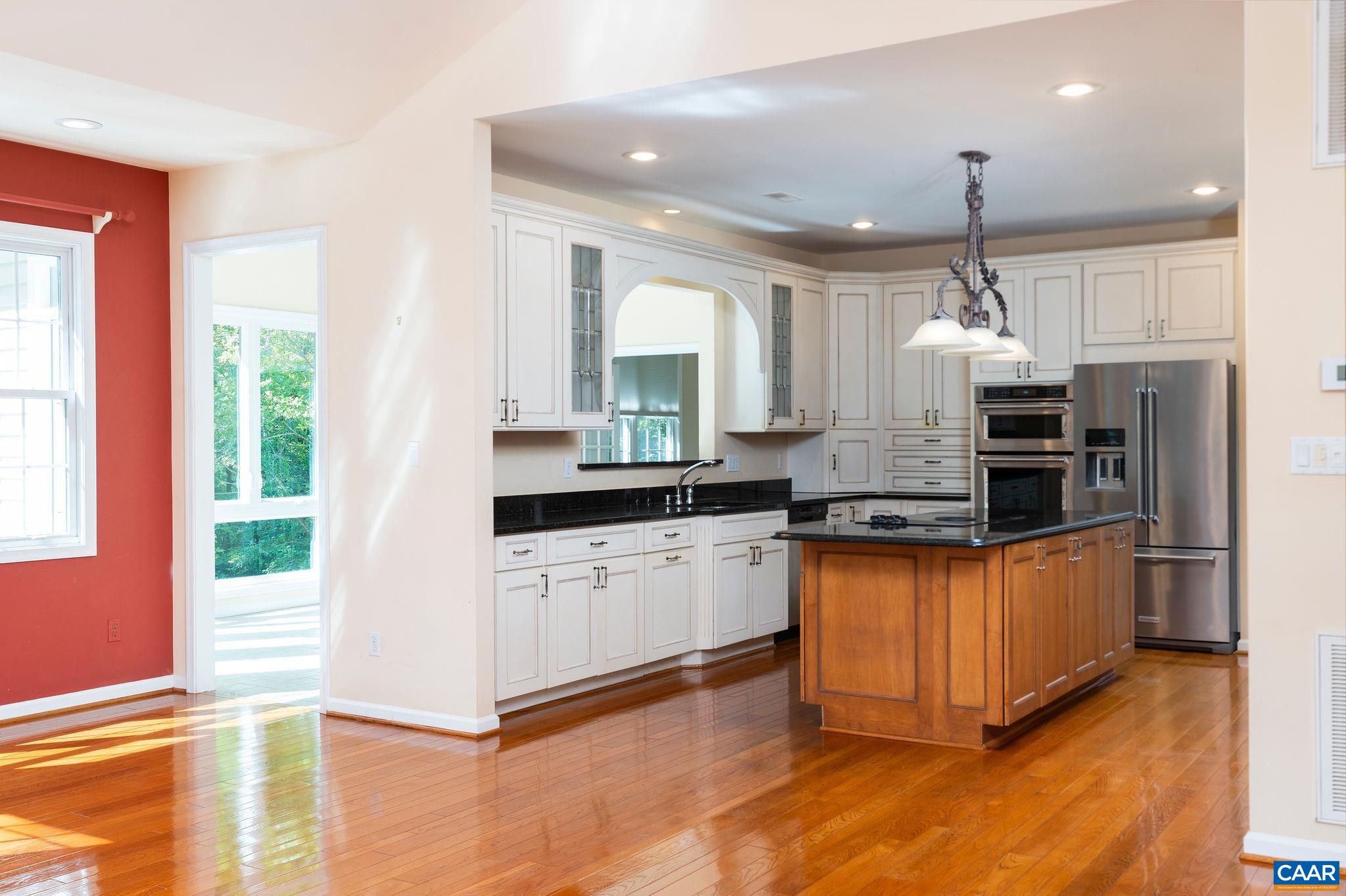 21 Amethyst Road Palmyra, VA 22963 - Photo 11 of 66 a kitchen with stainless steel appliances granite countertop a stove top oven a sink dishwasher a refrigerator and white cabinets with wooden floor