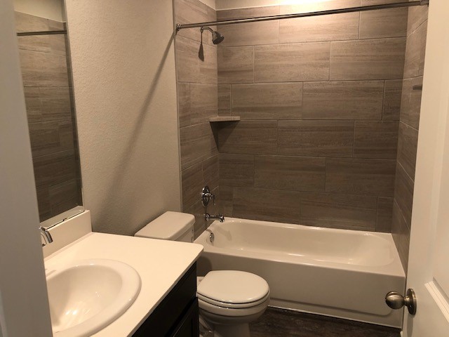 1237 Oak Chase Way Leander, TX 78641 - Photo 14 of 19 a bathroom with a sink a toilet and bathtub
