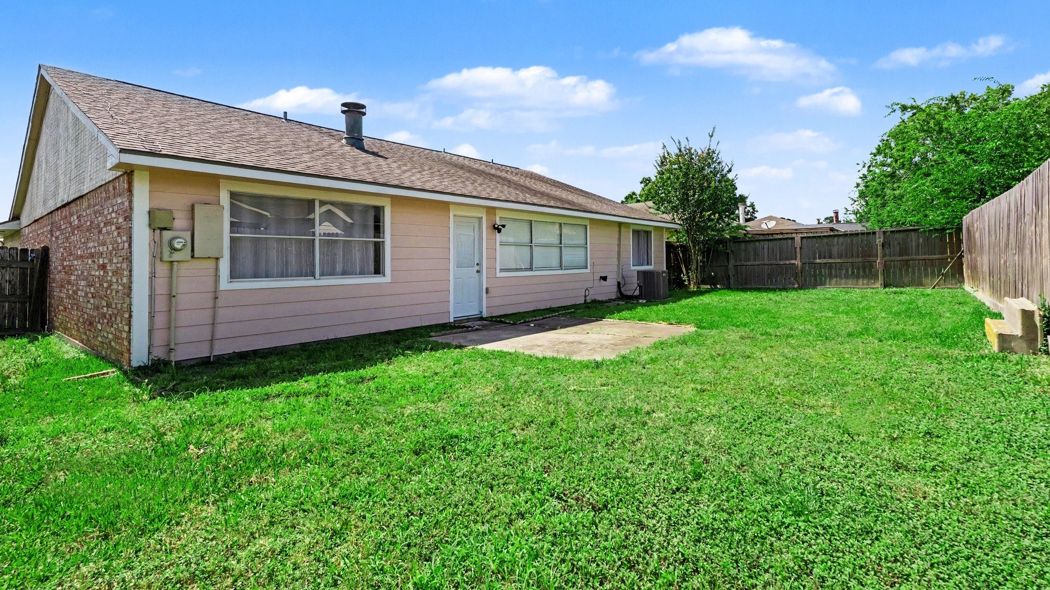 1506 Holbech Lane Channelview, TX 77530 - Photo 20 of 21 a front view of a house with garden