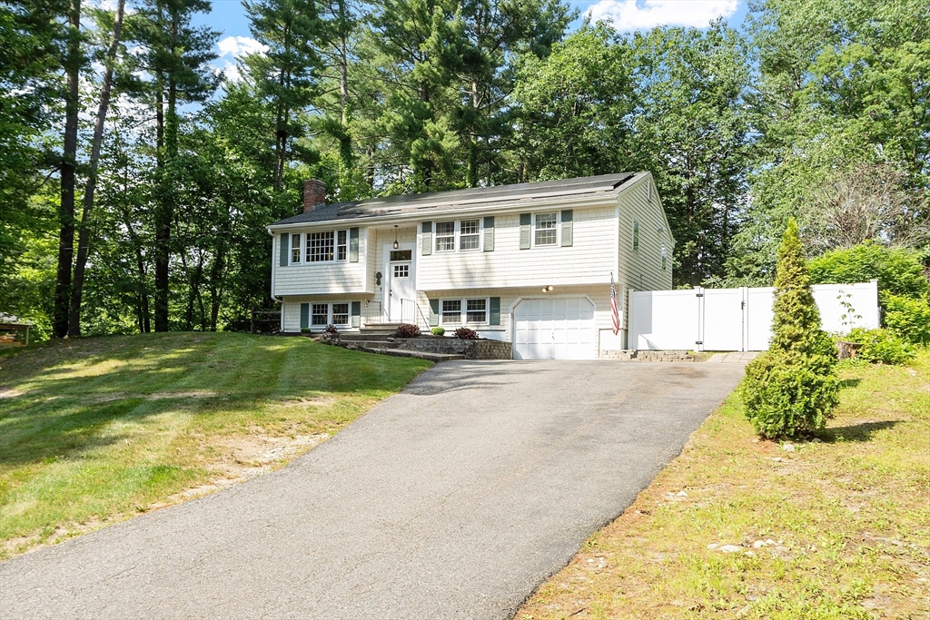 14 Emery Road Townsend, MA 01469 - Photo 1 of 31 a front view of a house with a yard