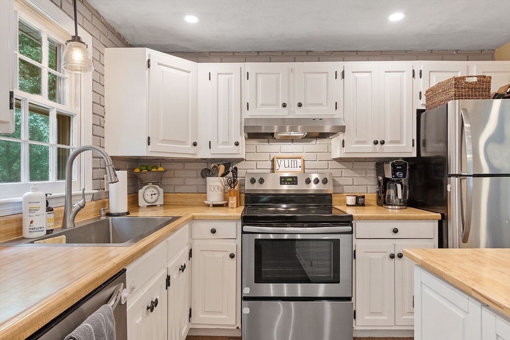 14 Emery Road Townsend, MA 01469 - Photo 12 of 31 a kitchen with cabinets appliances and a sink