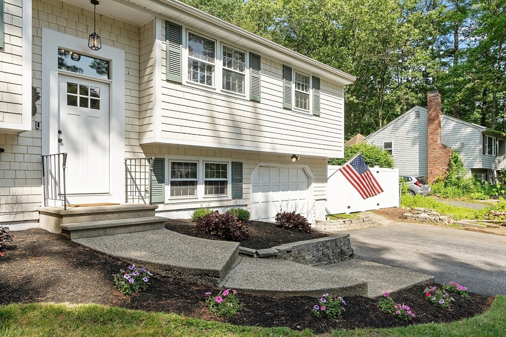 14 Emery Road Townsend, MA 01469 - Photo 2 of 31 a front view of a house with garden