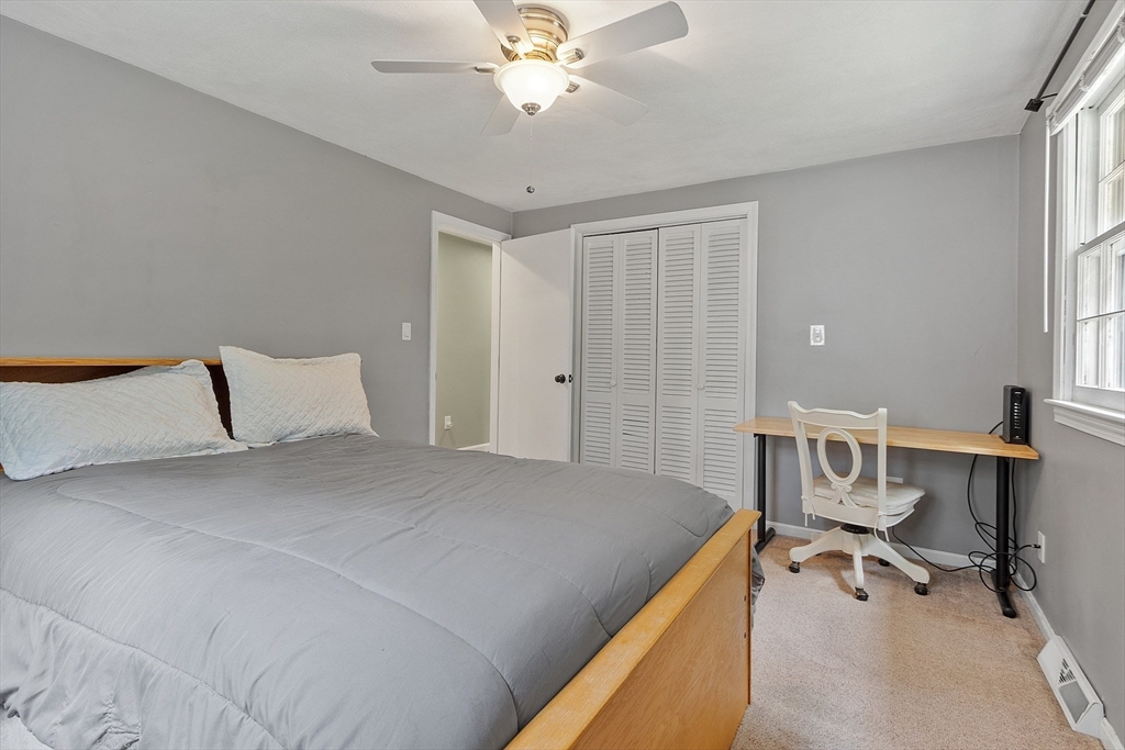 14 Emery Road Townsend, MA 01469 - Photo 23 of 31 a bedroom with a bed and a chandelier