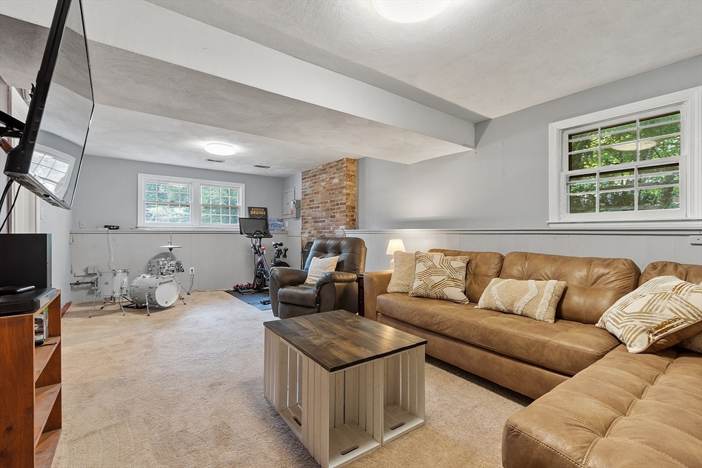 14 Emery Road Townsend, MA 01469 - Photo 26 of 31 a living room with furniture large window and flat screen tv