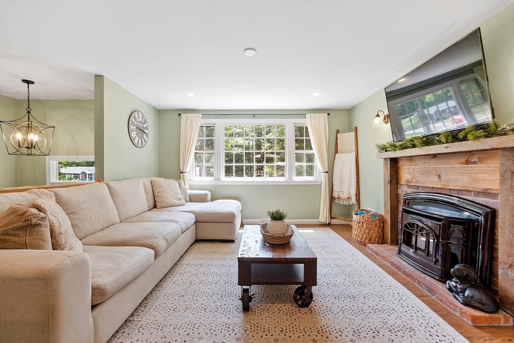 14 Emery Road Townsend, MA 01469 - Photo 8 of 31 a living room with furniture a window and a fireplace