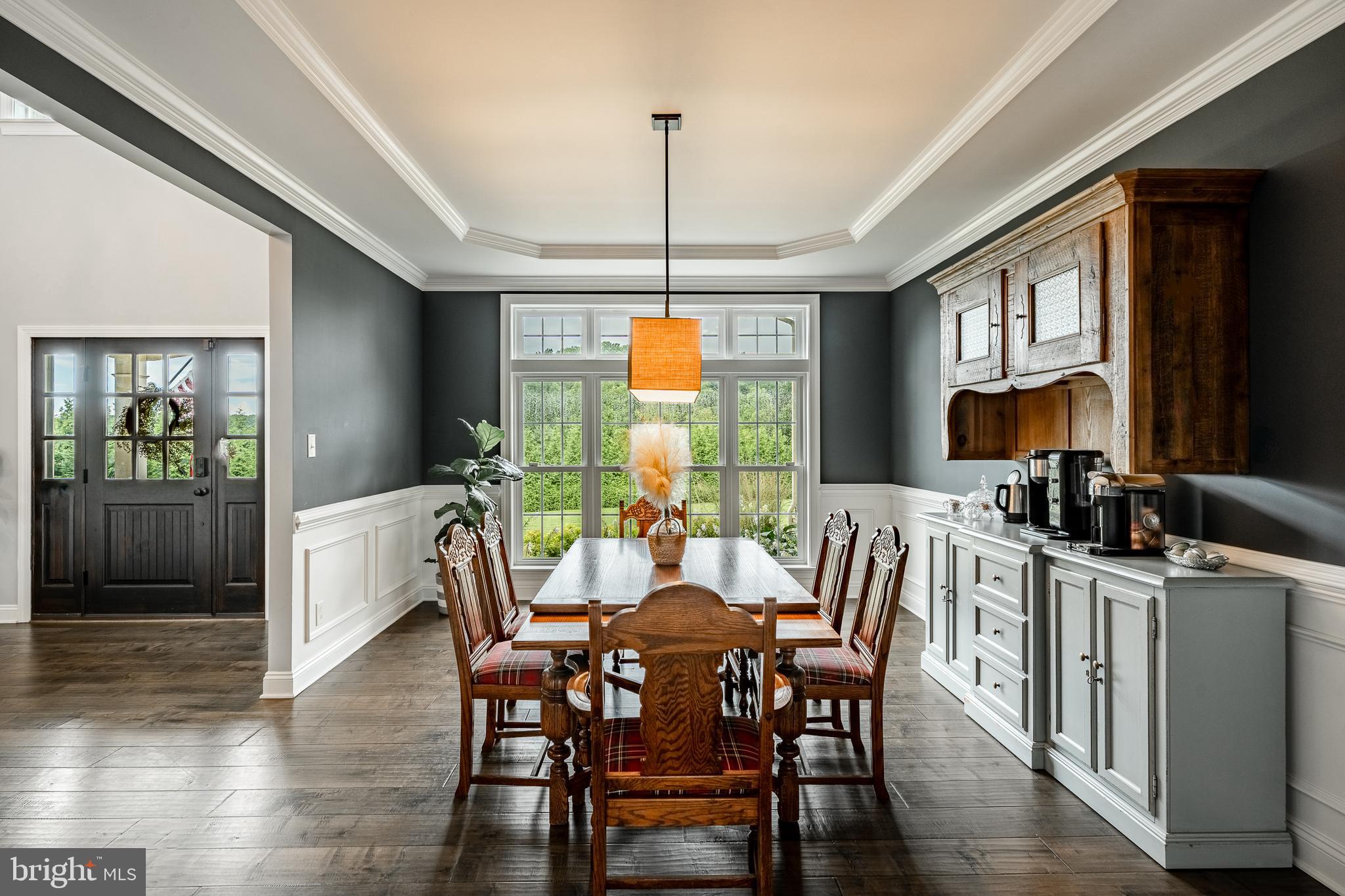 2084 Flowing Springs Road Chester Springs, PA 19425 - Photo 12 of 73 a view of a dining room with furniture window and wooden floor