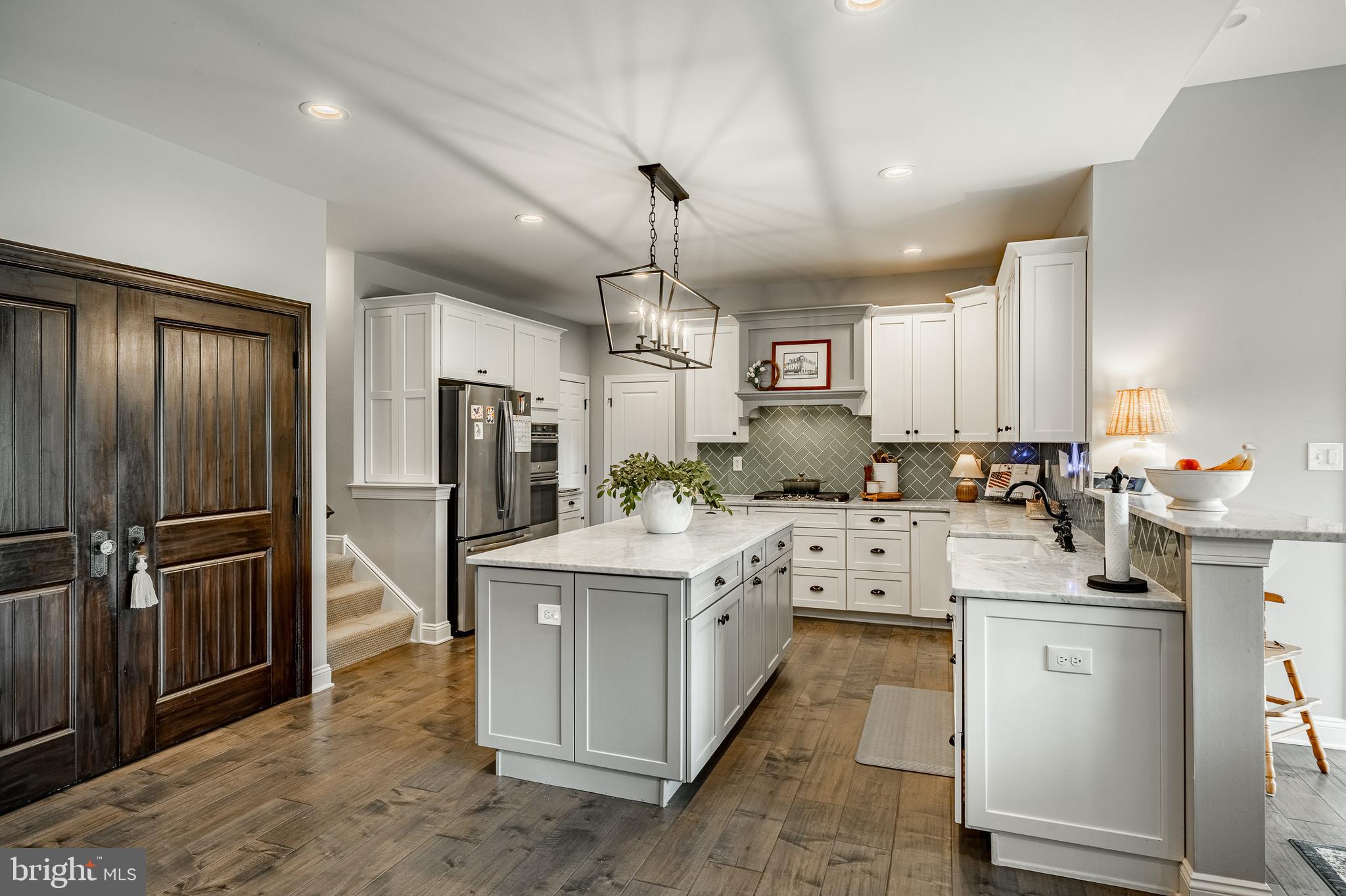 2084 Flowing Springs Road Chester Springs, PA 19425 - Photo 17 of 73 a kitchen that has a lot of cabinets and stainless steel appliances
