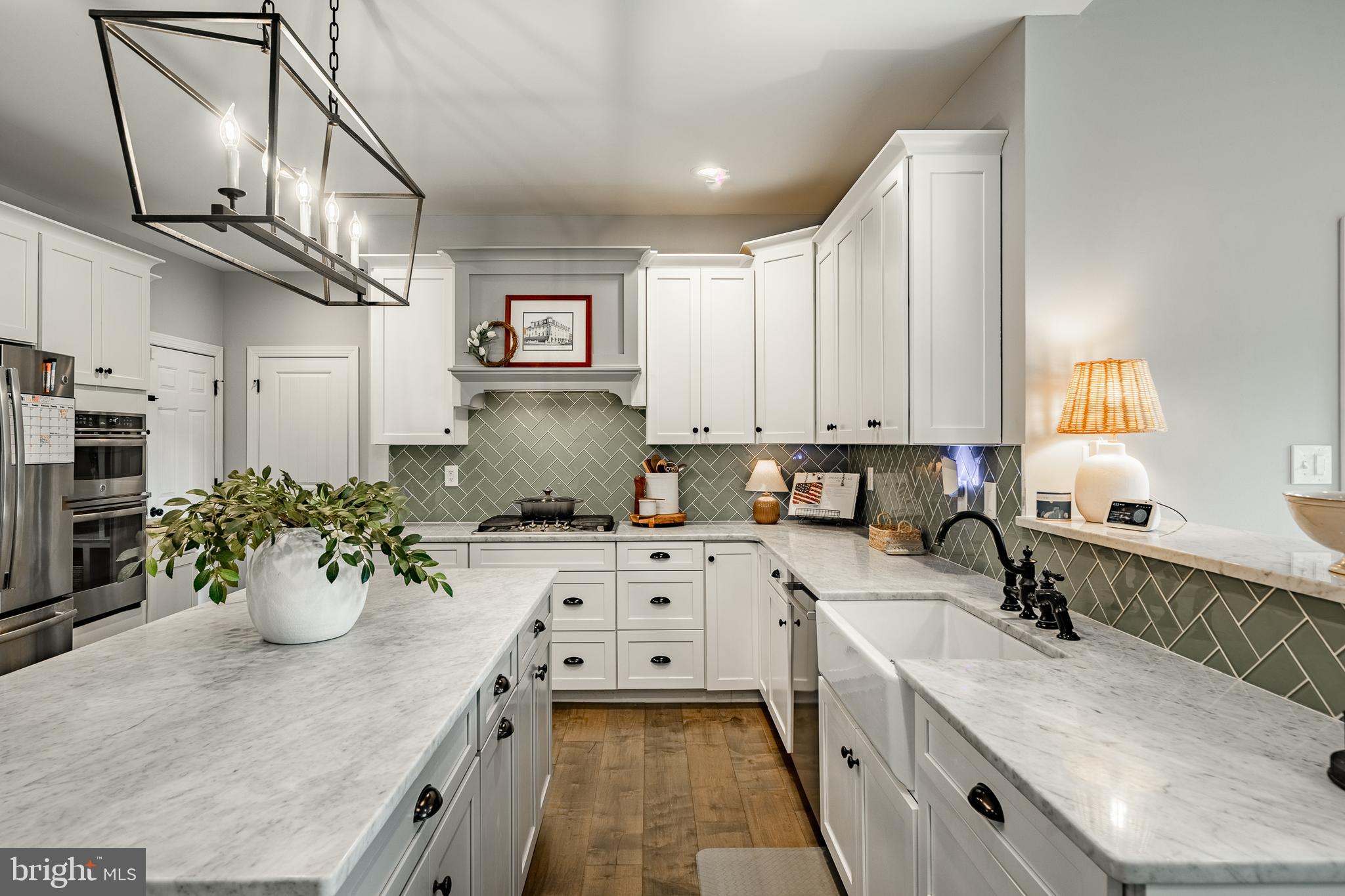 2084 Flowing Springs Road Chester Springs, PA 19425 - Photo 18 of 73 a kitchen with a sink stove and cabinets