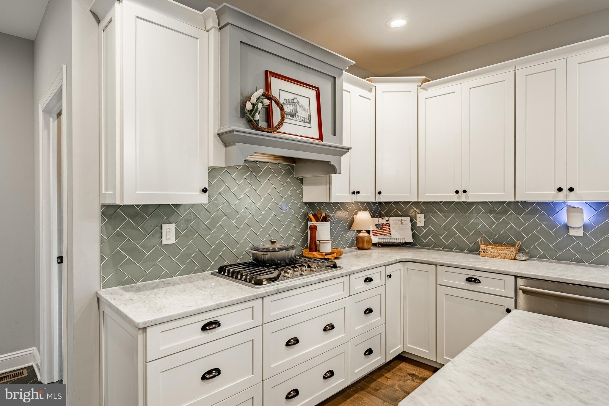 2084 Flowing Springs Road Chester Springs, PA 19425 - Photo 19 of 73 a kitchen with stainless steel appliances granite countertop a stove and cabinets